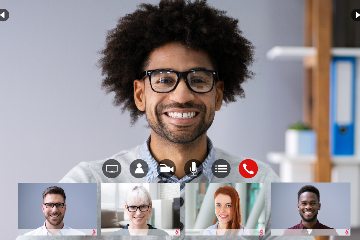 Smiling man in a video meeting with colleagues.