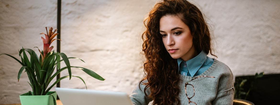 Professional woman focused on laptop. 